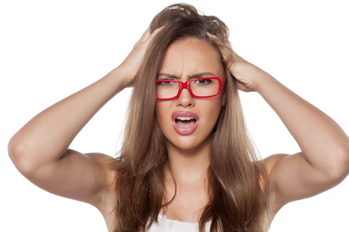 Woman frustrated by seborrhoeic dermatitis on her face